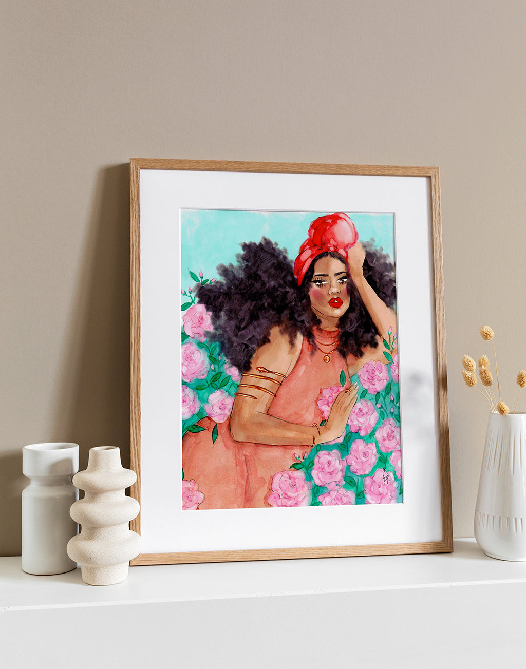 Illustration in a light frame of a beautiful black woman laying in a rose bush by Tatiana Poblah